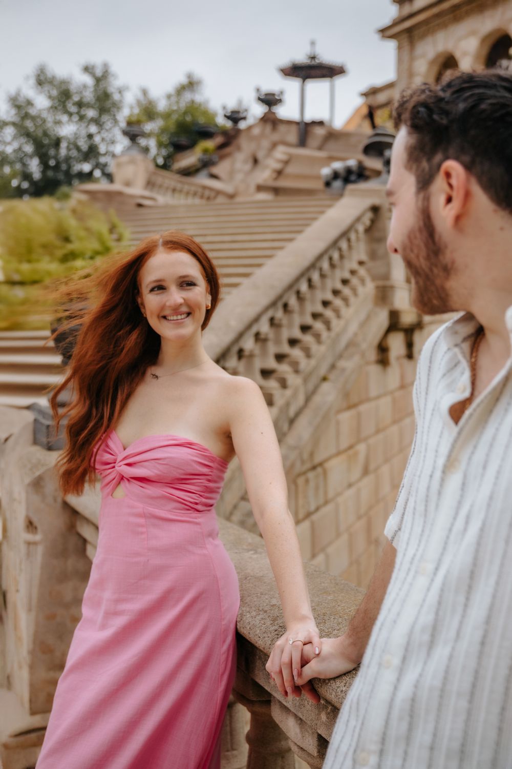 Couple walking hand in hand after the proposal.