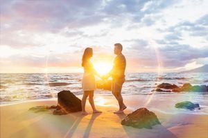 Maui couple engagement photographer photo against beautiful Maui sunset beach by ohwowfotos.