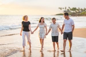 Maui family photographer photo against beautiful Maui sunset beach by ohwowfotos.