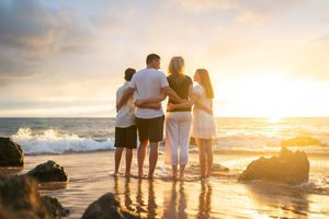 Maui family photographer photo against beautiful Maui sunset beach by ohwowfotos.