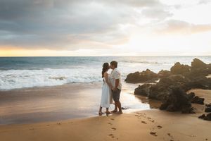 Maui couple engagement photographer photo against beautiful Maui sunset beach by ohwowfotos.