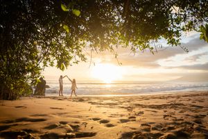 Maui couple engagement photographer photo against beautiful Maui sunset beach by ohwowfotos.