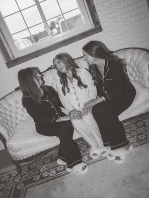 Black and white photo showing intimate moments on a vintage sofa.
