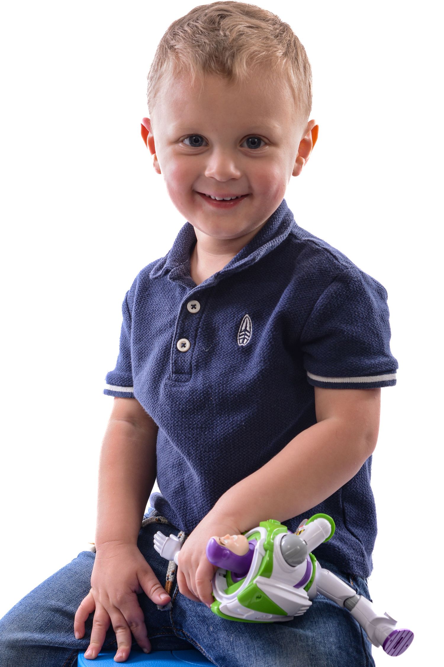 Studio photo of little boy, holding disney toy, by Poole, Bournemouth and Dorset wedding photographer "kris the photographer"