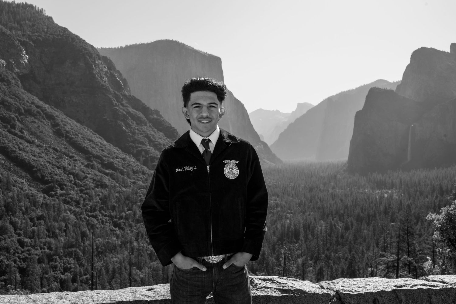 A scenic black and white photo series showing seven profile views against a mountainous forest landscape background.