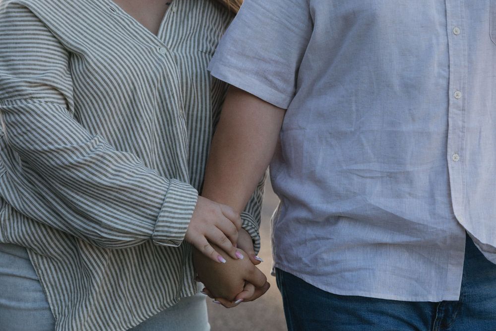 Up close photo of a couple holding hands during their engagement session in North Georgia.