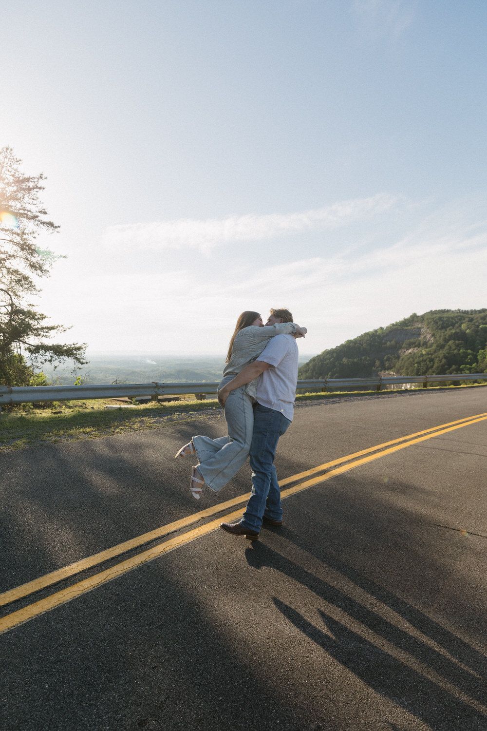 A groom spins around his bride to be during their North Georgia engagement session.