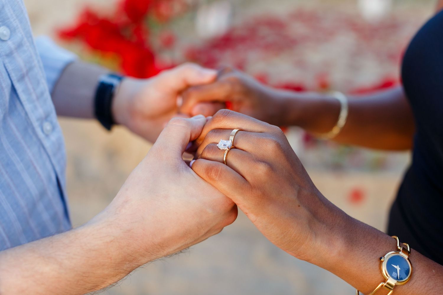 Holding hands. Marriage proposal on the beach in Isla Verde, Carolina, Puerto Rico.