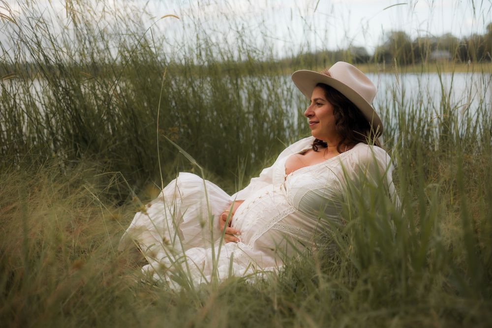 A beautiful maternity portrait taken on the Brisbane Northside with natural light, capturing the joy of an expecting Mother