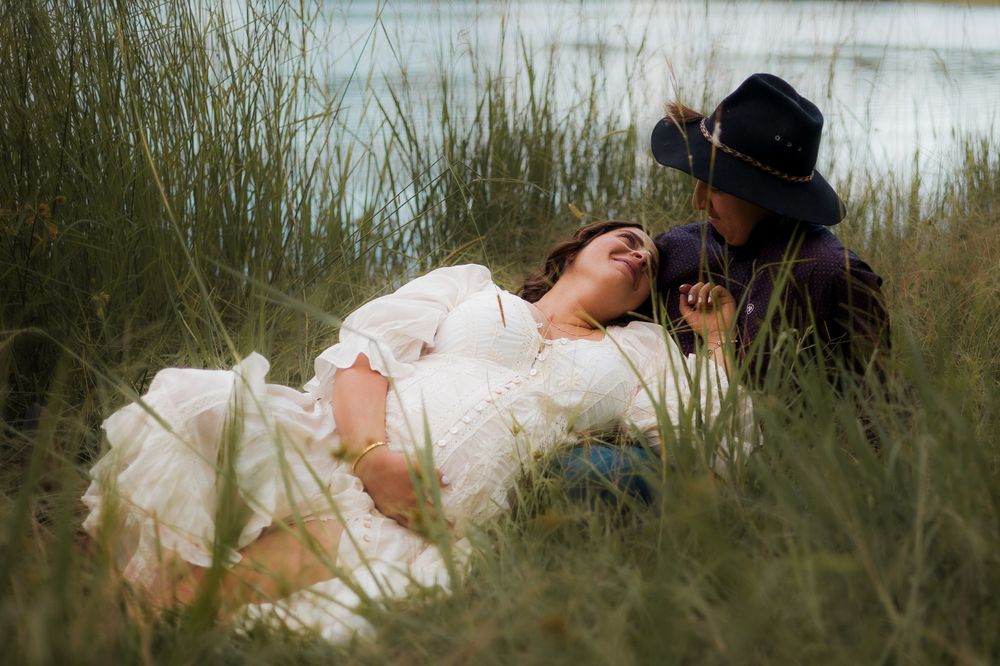 A gorgeous maternity portrait taken on the Brisbane Northside with natural light, capturing the joy of expecting parents