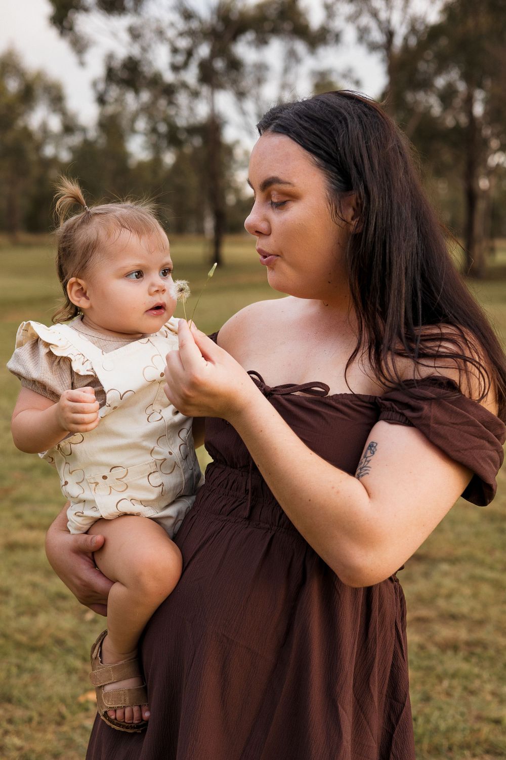 Mother and toddler enjoying a photoshoot at Kingaroy Dam, bathed in warm golden light during sunset.