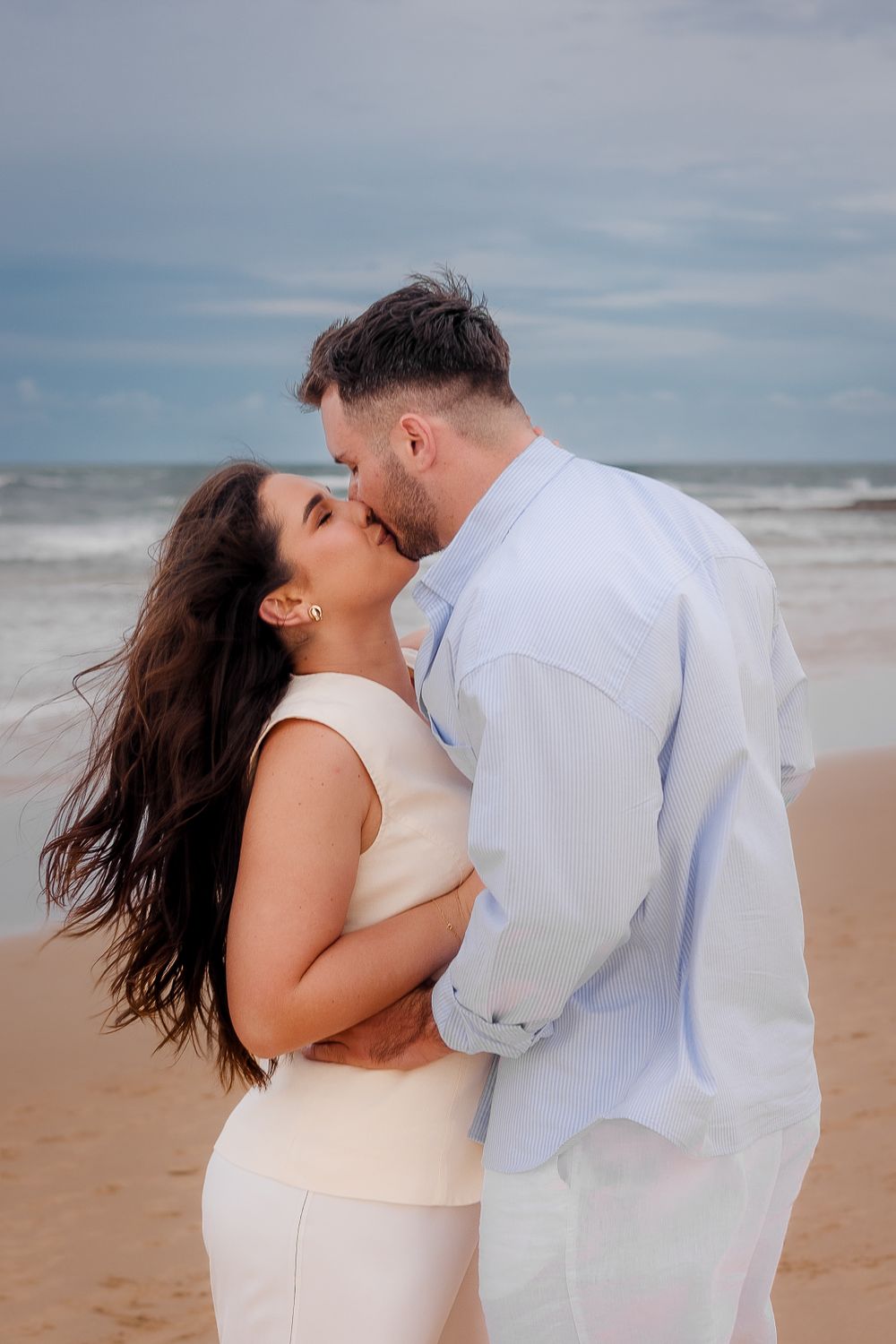 Couple portrait on the beach at sunset in the Sunshine Coast