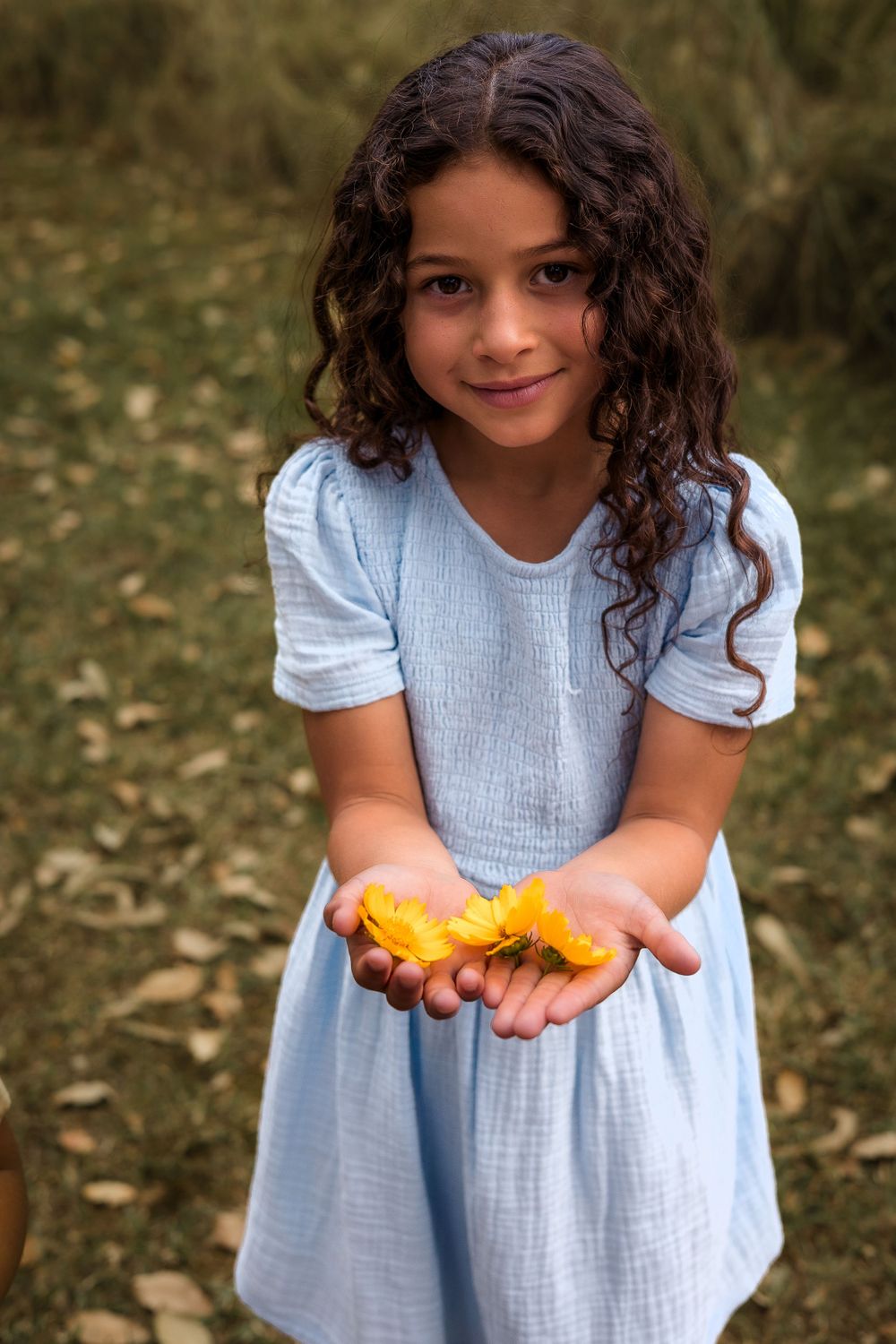 Candid kids photoshoot in a shaded, bushy location in Nanango, South Burnett, capturing playful moments in nature