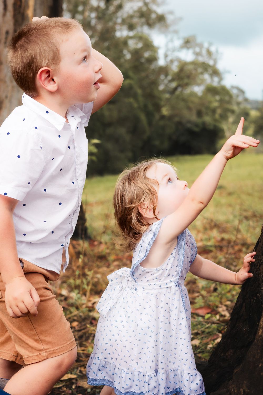 Children candid photography on a farm in Gympie after a storm, capturing a joyful and carefree moment in nature during photoshoot