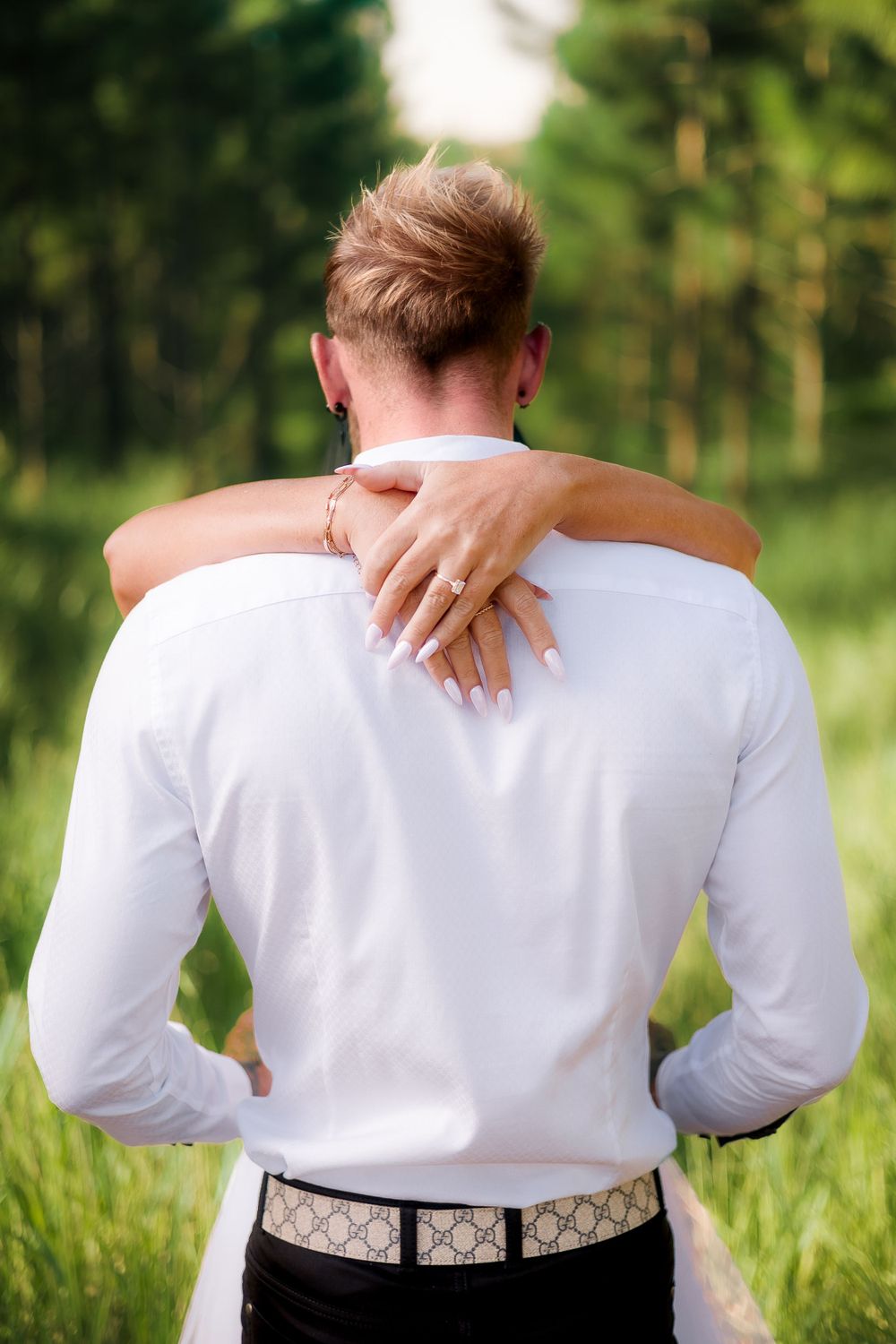 Engagement photography session with couple kissing and showing off engagement ring in beerwah forest on the Sunshine Coast at sunset