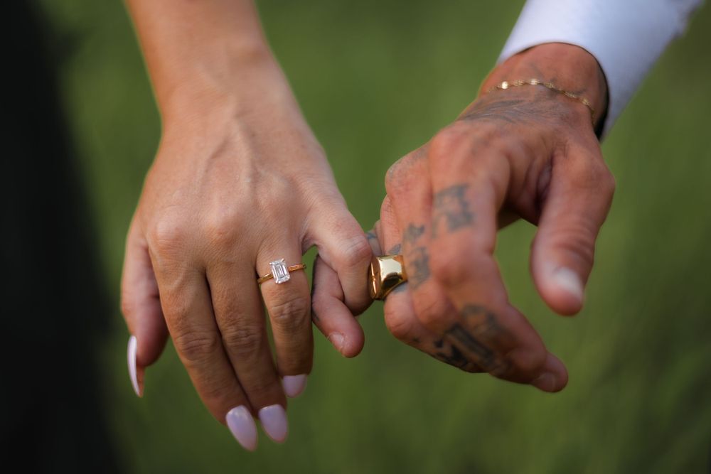 Engagement photography session with couple holding hands and showing off engagement ring in beerwah forest on the Sunshine Coast at sunset