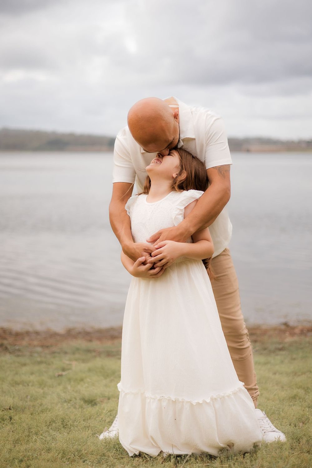 joyful dad and daughter having fun at Lake Samsonvale, Joyner, with candid moments of laughter and happiness by the lakeside