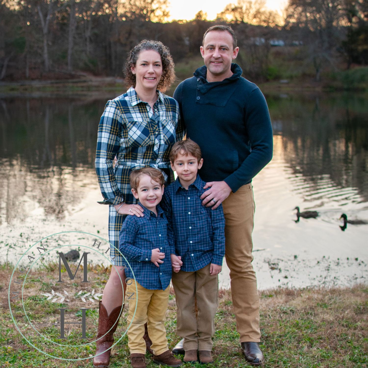 Family of 4 near Lake Fairfax ducks in background photo