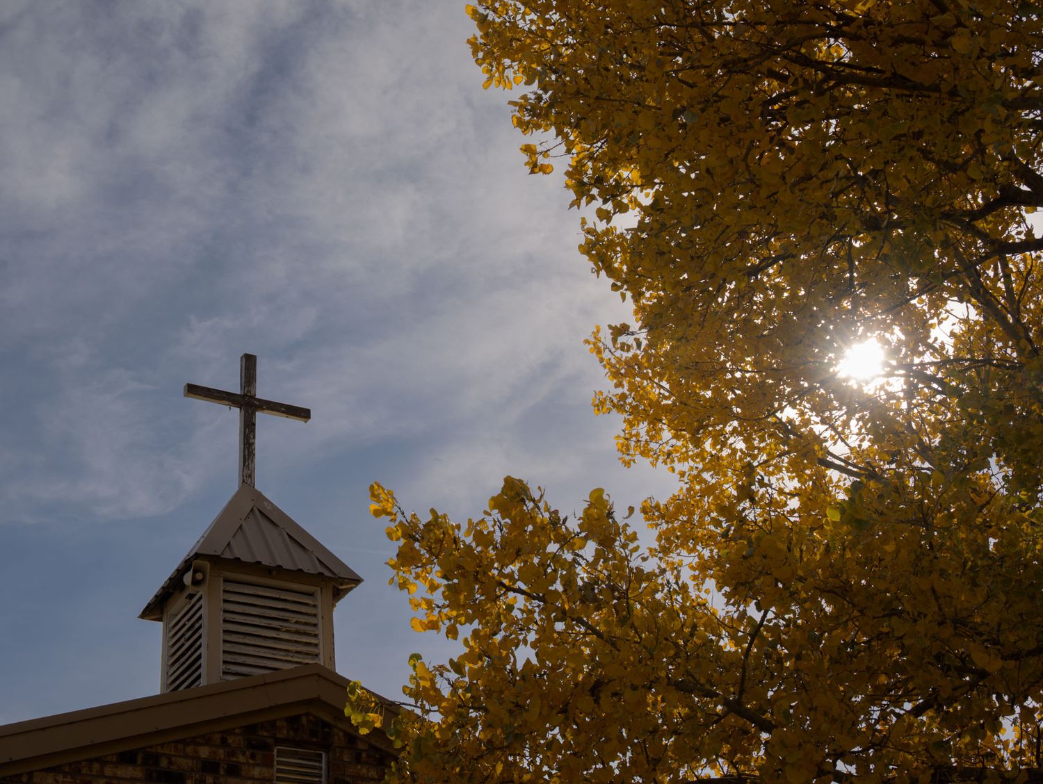Church cross amid Fall foliage near Craig, Colorado