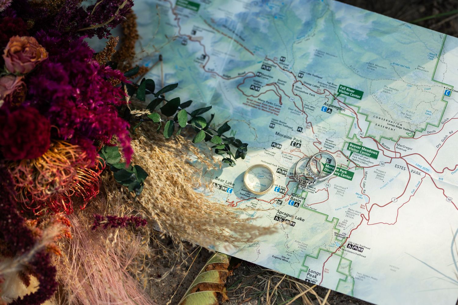 A map overlay on terrain with reddish coral formations and turquoise water in the background.