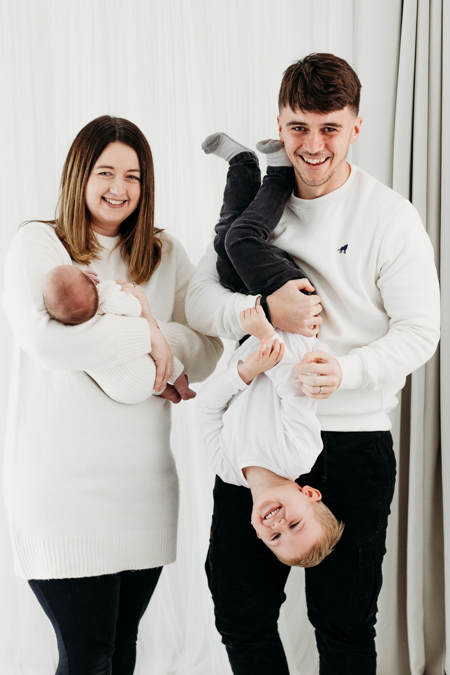 Nottingham family photographer capturing relaxed portraits of parents and children in Mapperley studio with soft natural light.