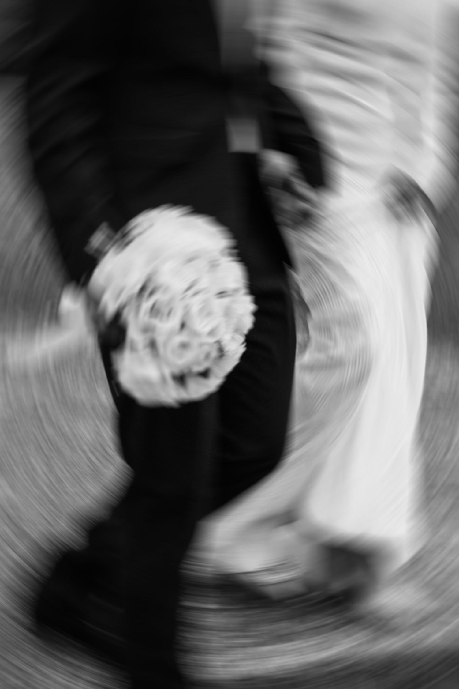 Abstract black and white motion blur of wedding couple dancing.
