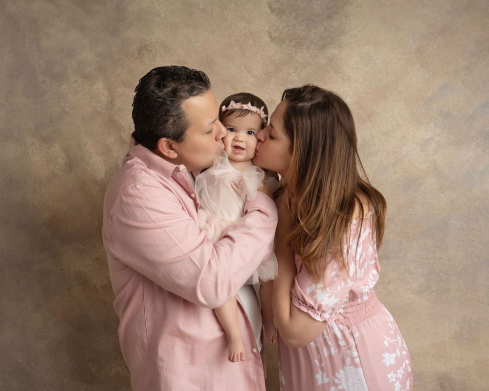 Heartwarming family photo sequence showing affectionate interaction in pink coordinated outfits.