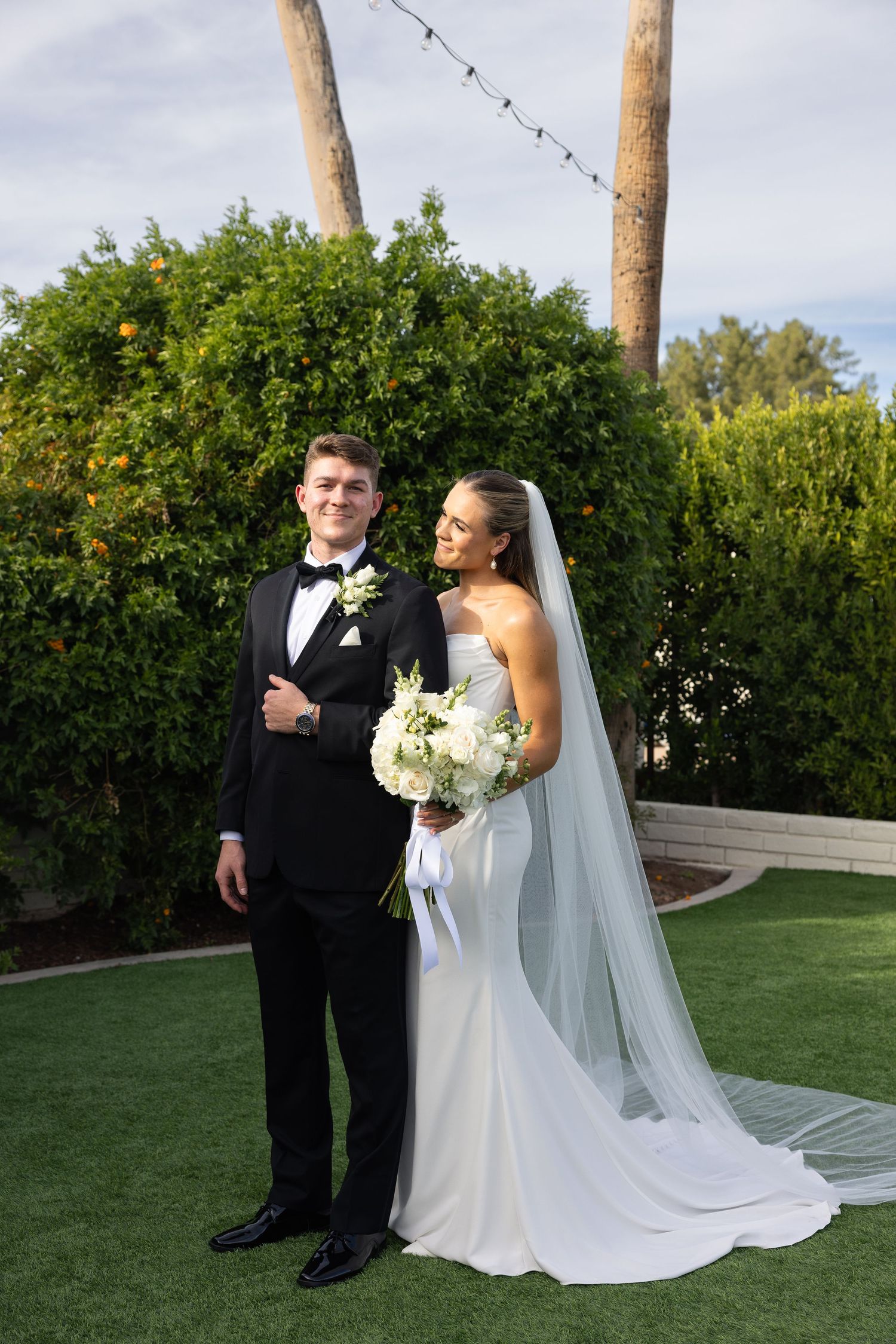 Couple photo session at sunset in the Greater Phoenix area, capturing a romantic moment with warm, glowing desert light.
