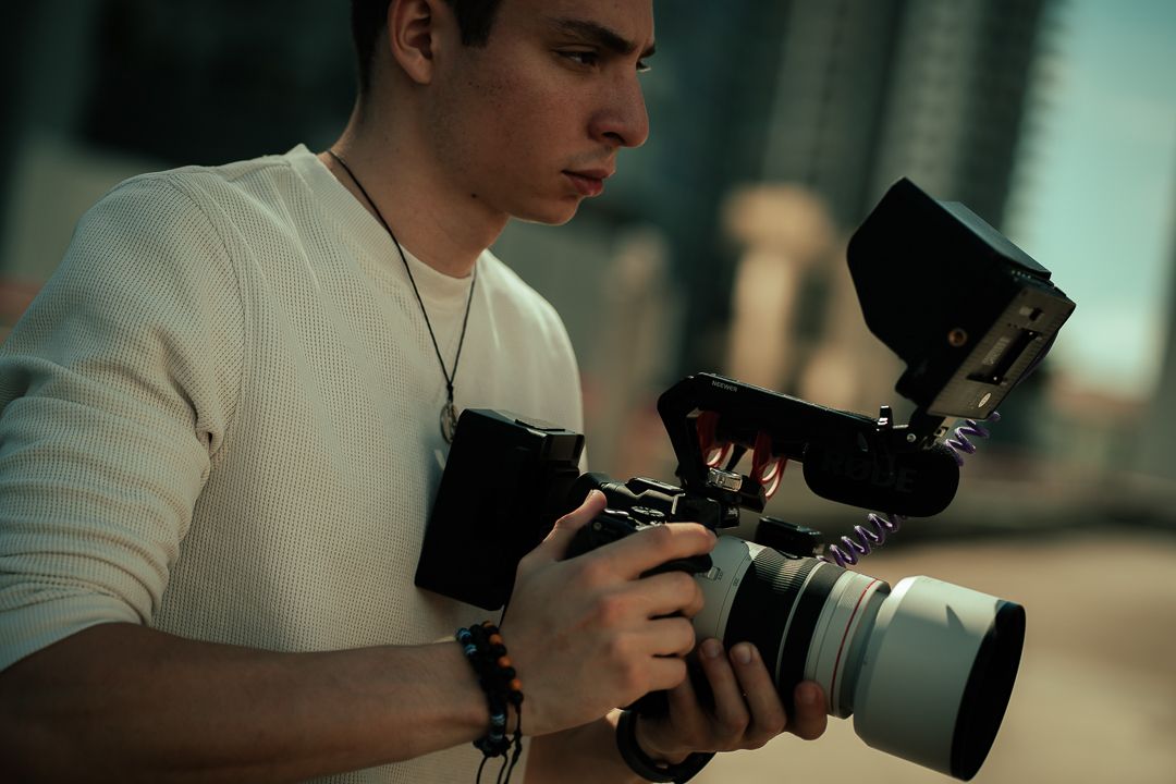 Passionate photographer adjusting camera settings, ready to capture cinematic moments. The art of storytelling through visuals.