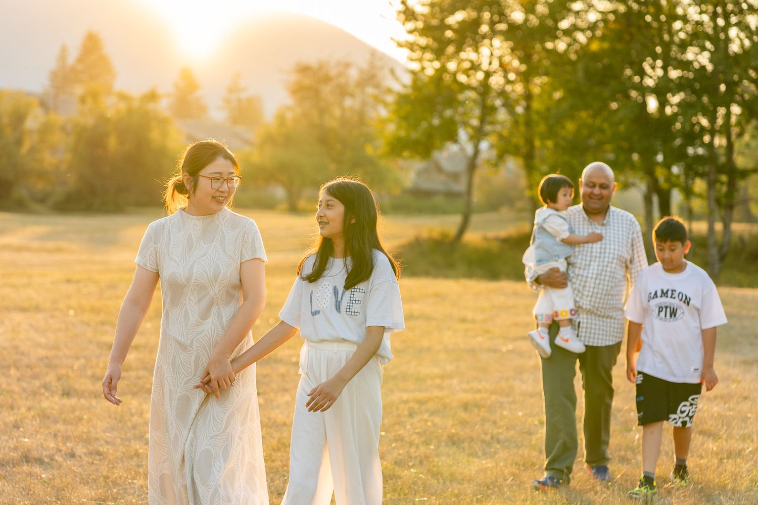 Family walks in North Bend at sunset.