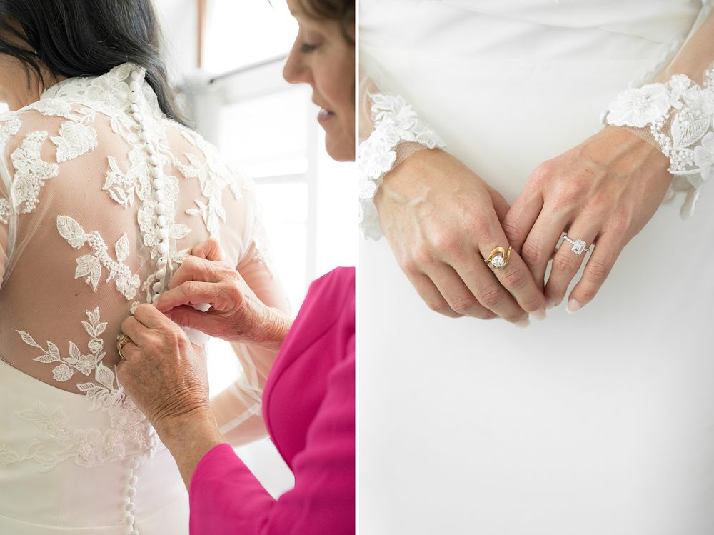 Bride in lace wedding dress being buttoned up, with close-up of hands wearing diamond engagement and wedding rings.