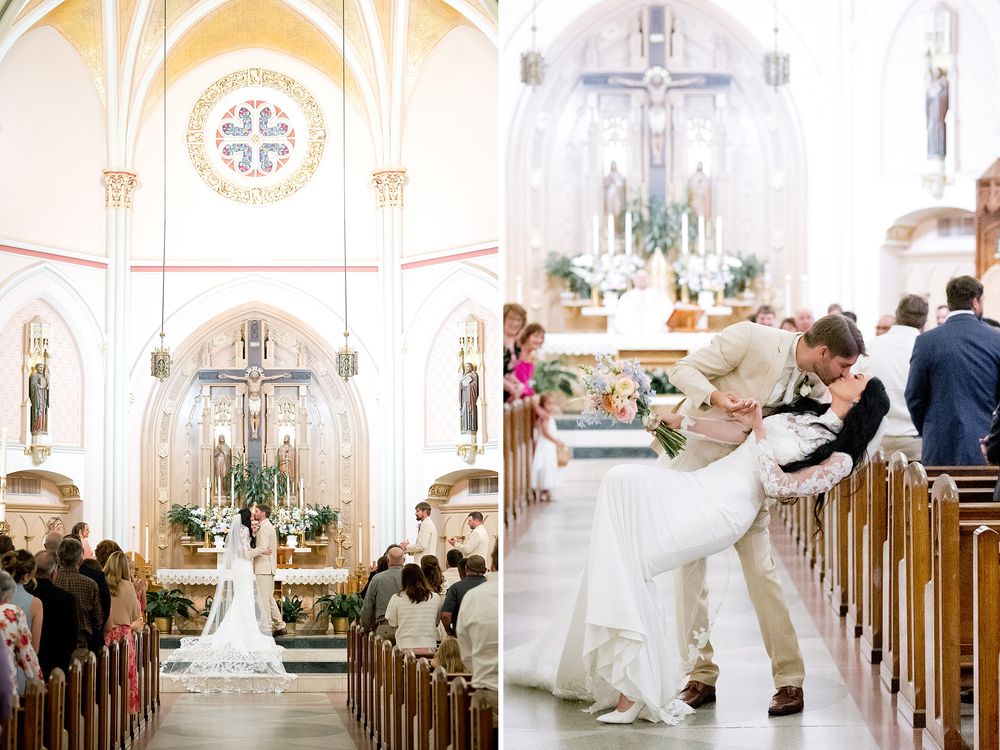 Bride and groom share a romantic dip kiss in a stunning white Catholic church during their elegant wedding ceremony.