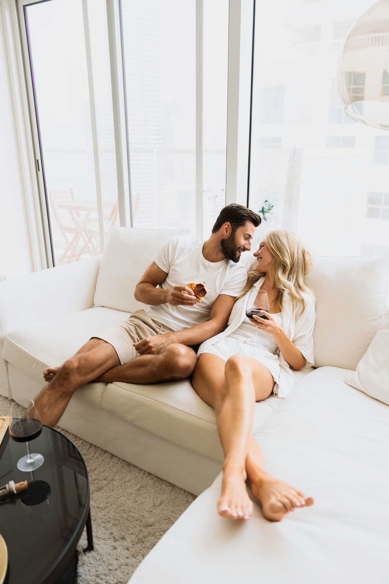 Intimate indoor couple session in soft natural window light