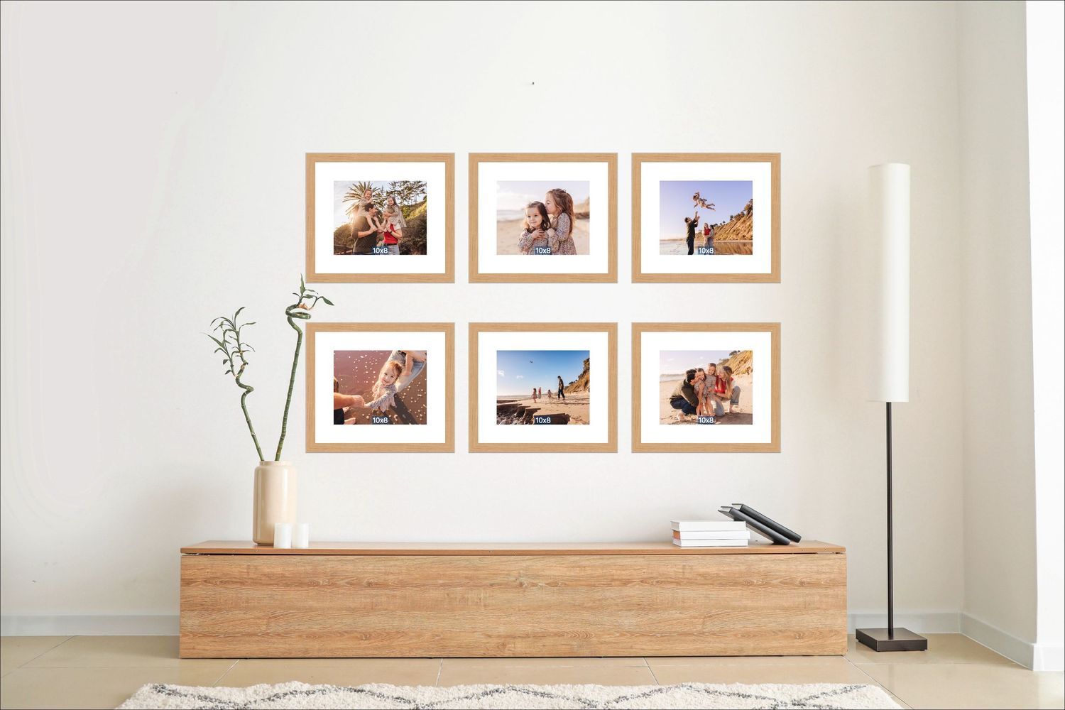 Six wooden-framed photo collage wall display above a modern oak sideboard in a minimalist living room.