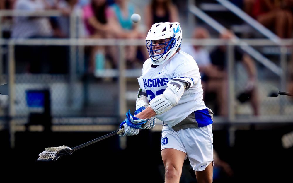 Lower Dauphin Falcons player scoops a ground ball vs. Palmyra, PIAA Districts by Deanna Fox, SportsFox Photography based in Hershey PA