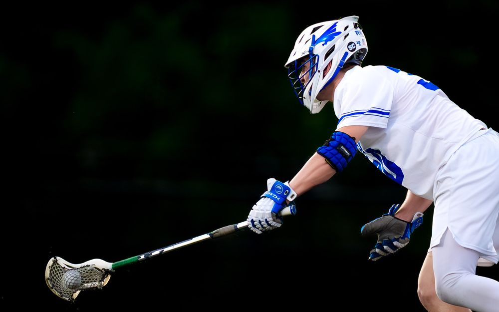 Lower Dauphin Falcons midfielder cradles the ball vs. Palmyra, PIAA Districts by Deanna Fox, SportsFox Photography based in Hershey PA