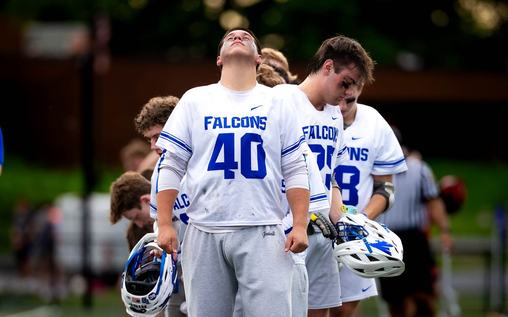 Lower Dauphin Falcons #40 and teammates during pledge vs. Palmyra, PIAA Districts by Deanna Fox, SportsFox Photography based in Hershey PA