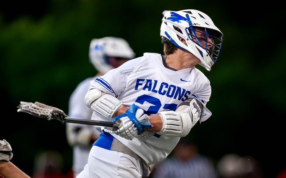 Lower Dauphin Falcons player cradles past Palmyra defense, PIAA Districts lacrosse by Deanna Fox, SportsFox Photography based in Hershey PA