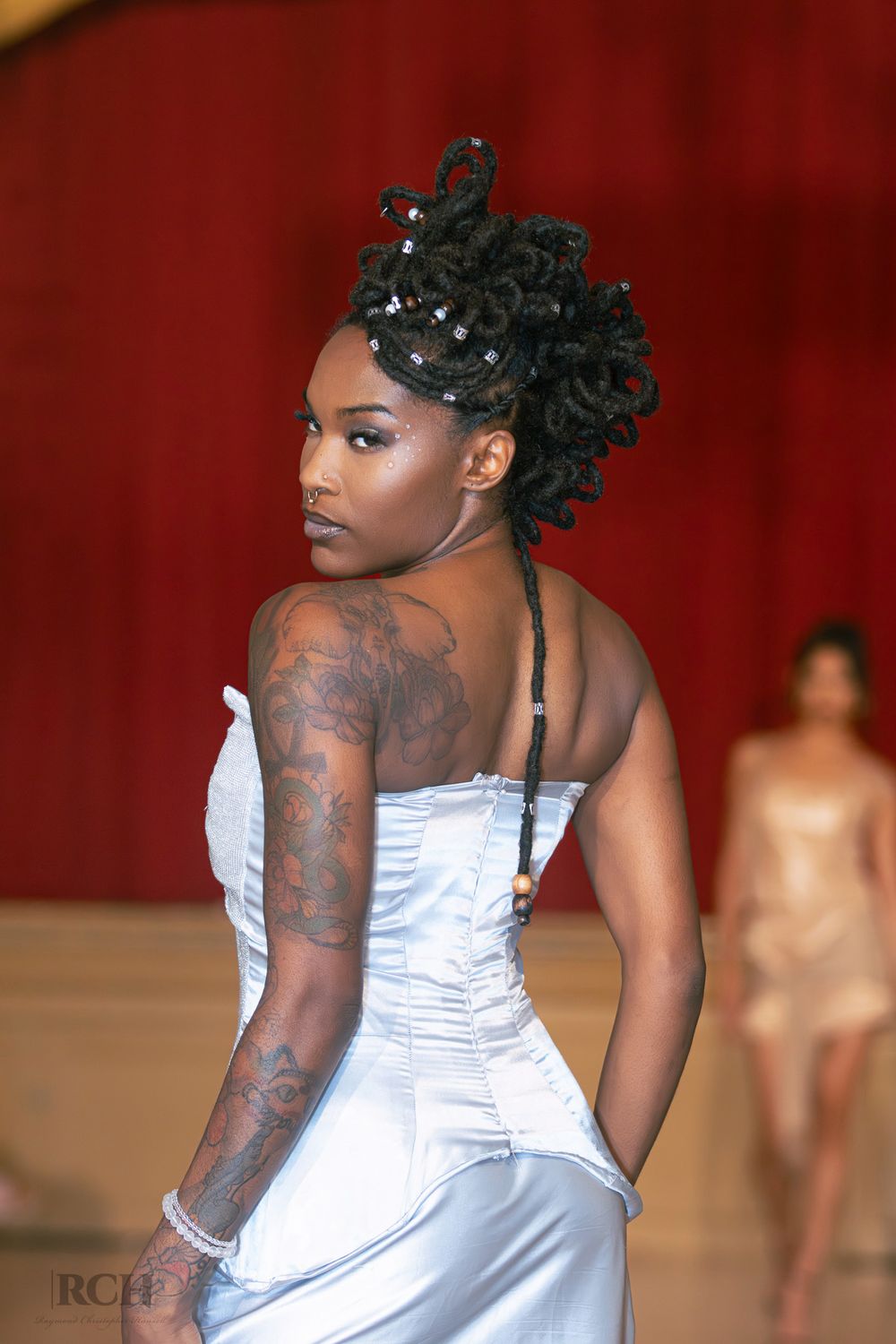 High-fashion runway portrait captured by Raymond C. Hansell Photography at a California fashion event.
