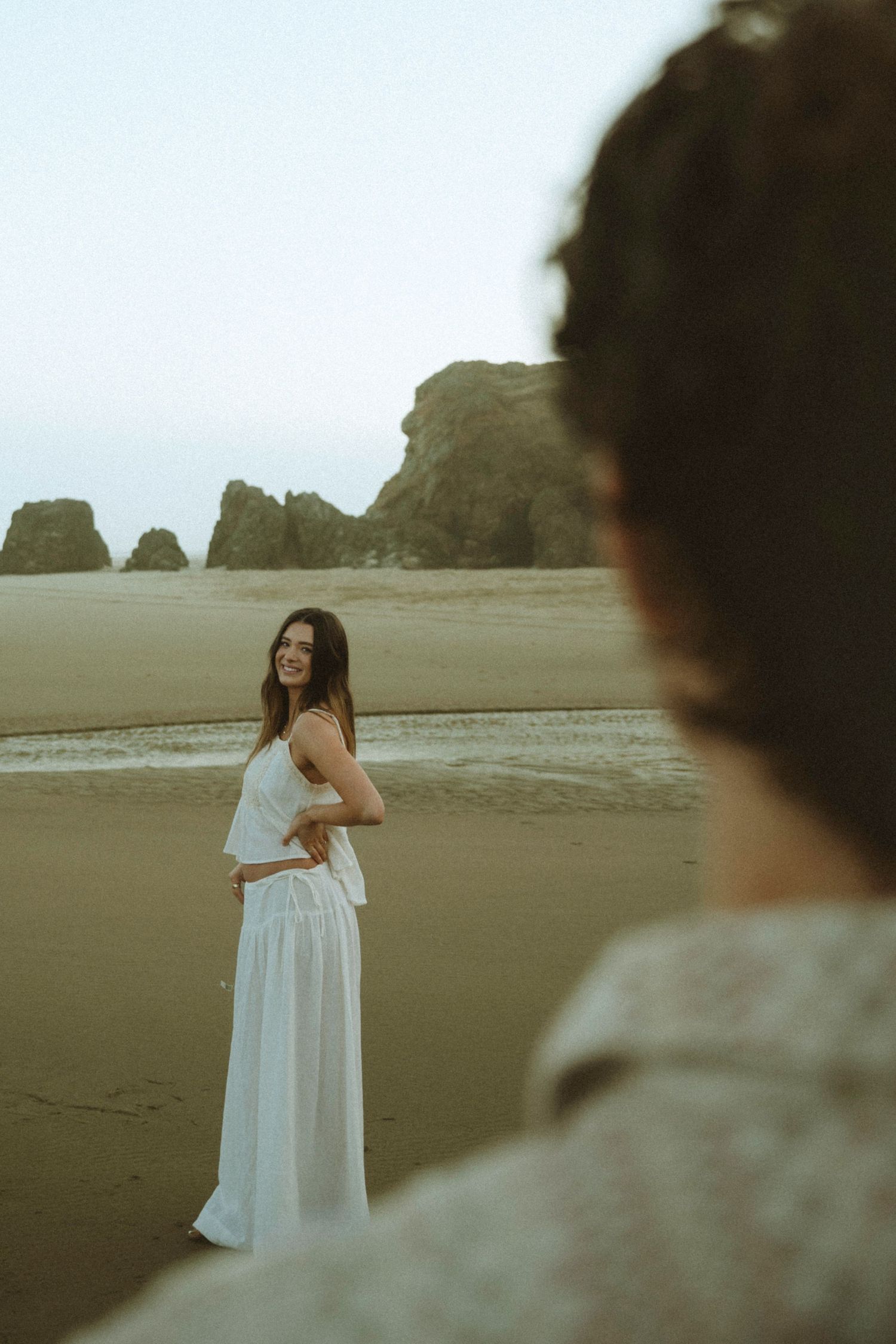 Panoramic sequence showing a wedding ceremony taking place in a modern white chapel with ocean views.