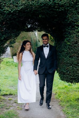 Engagement photography at Painswick Church with natural couple portraits.