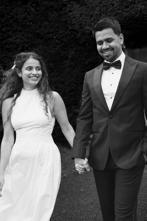 Relaxed engagement photoshoot in Gloucestershire with Cotswolds village backdrop.