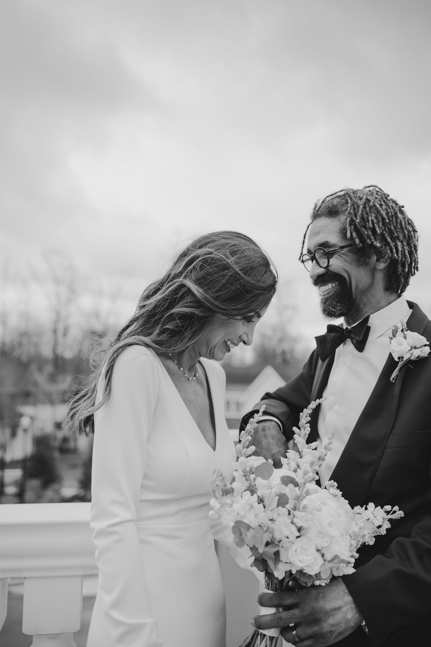 Bride and groom, laughing on their wedding day at Holliday Farms in Zionsville, Indiana