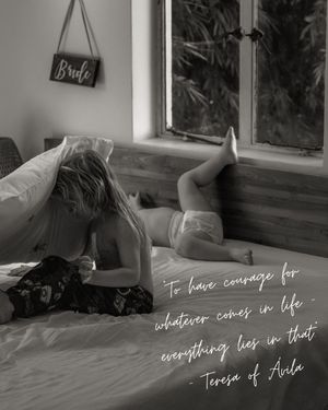 Black and white bedroom photo with inspirational quote from Teresa of Avila overlaid on dreamy scene.