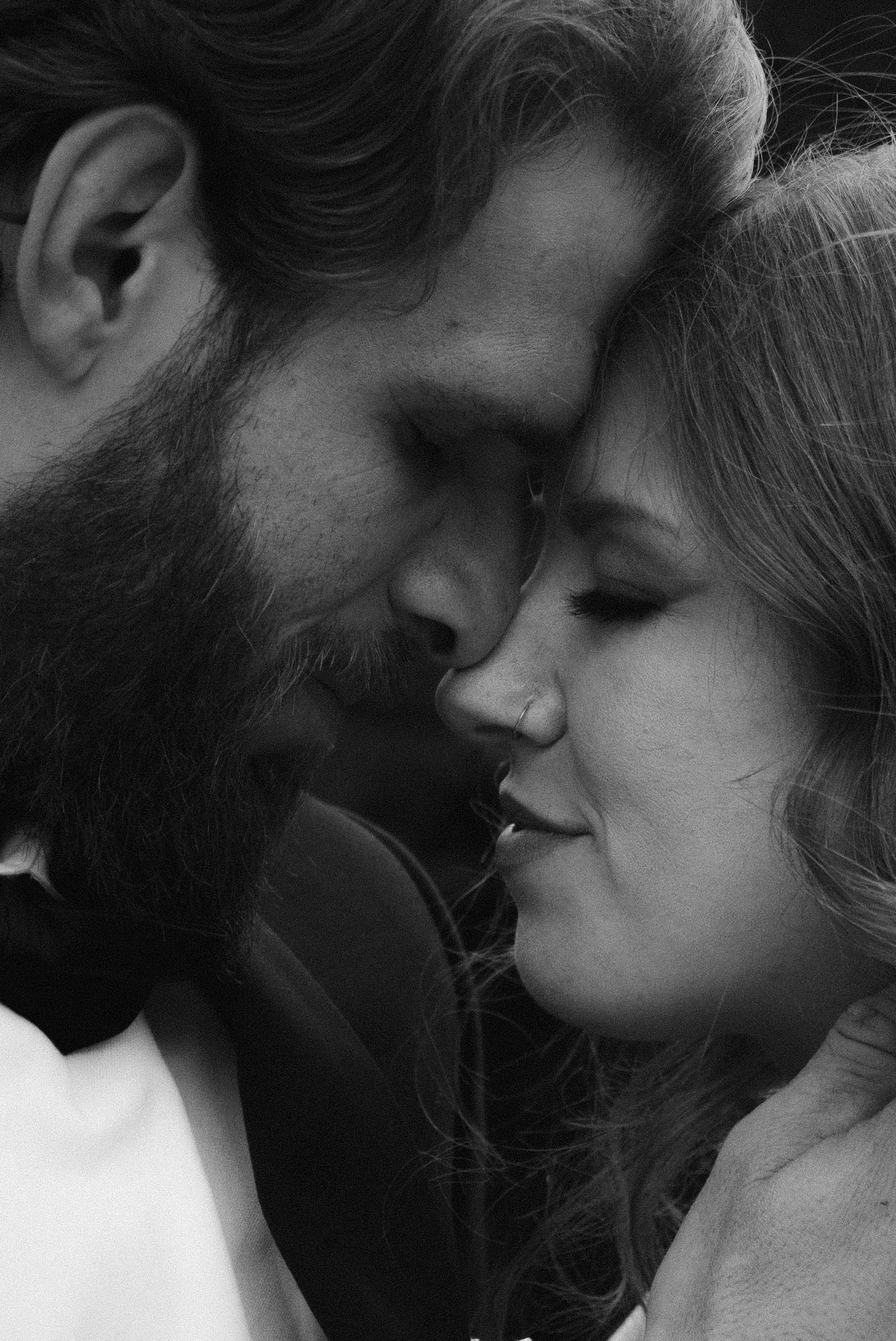 Dramatic black and white close-up of a tender romantic moment.