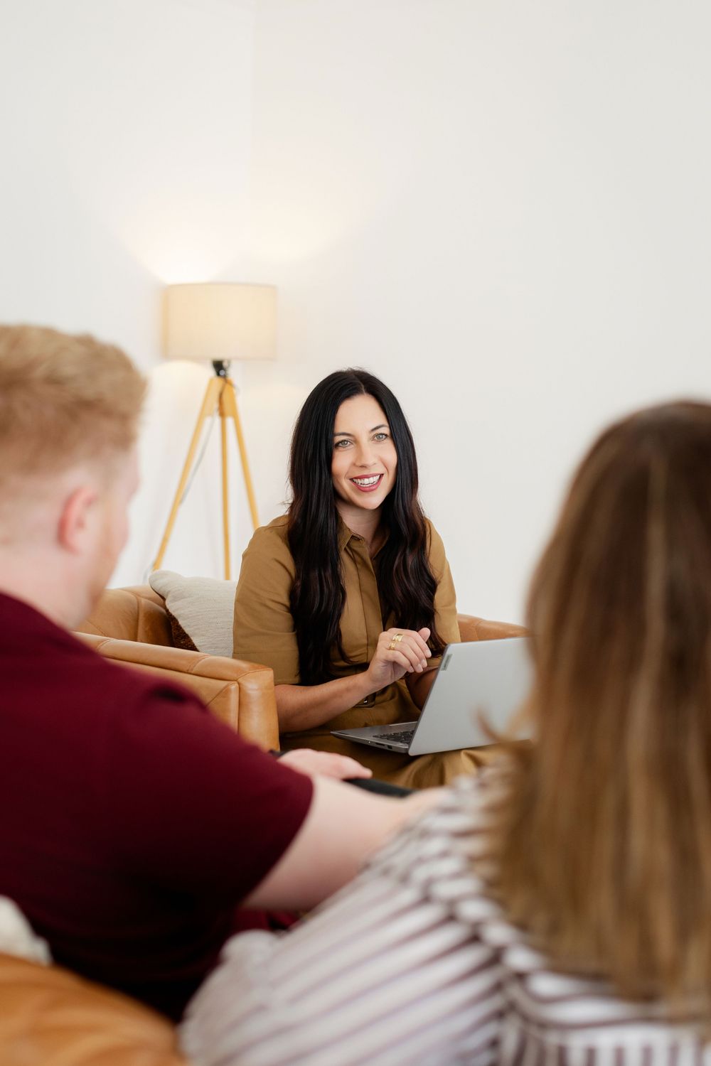A group of people having a casual business meeting during branding photos in Perth