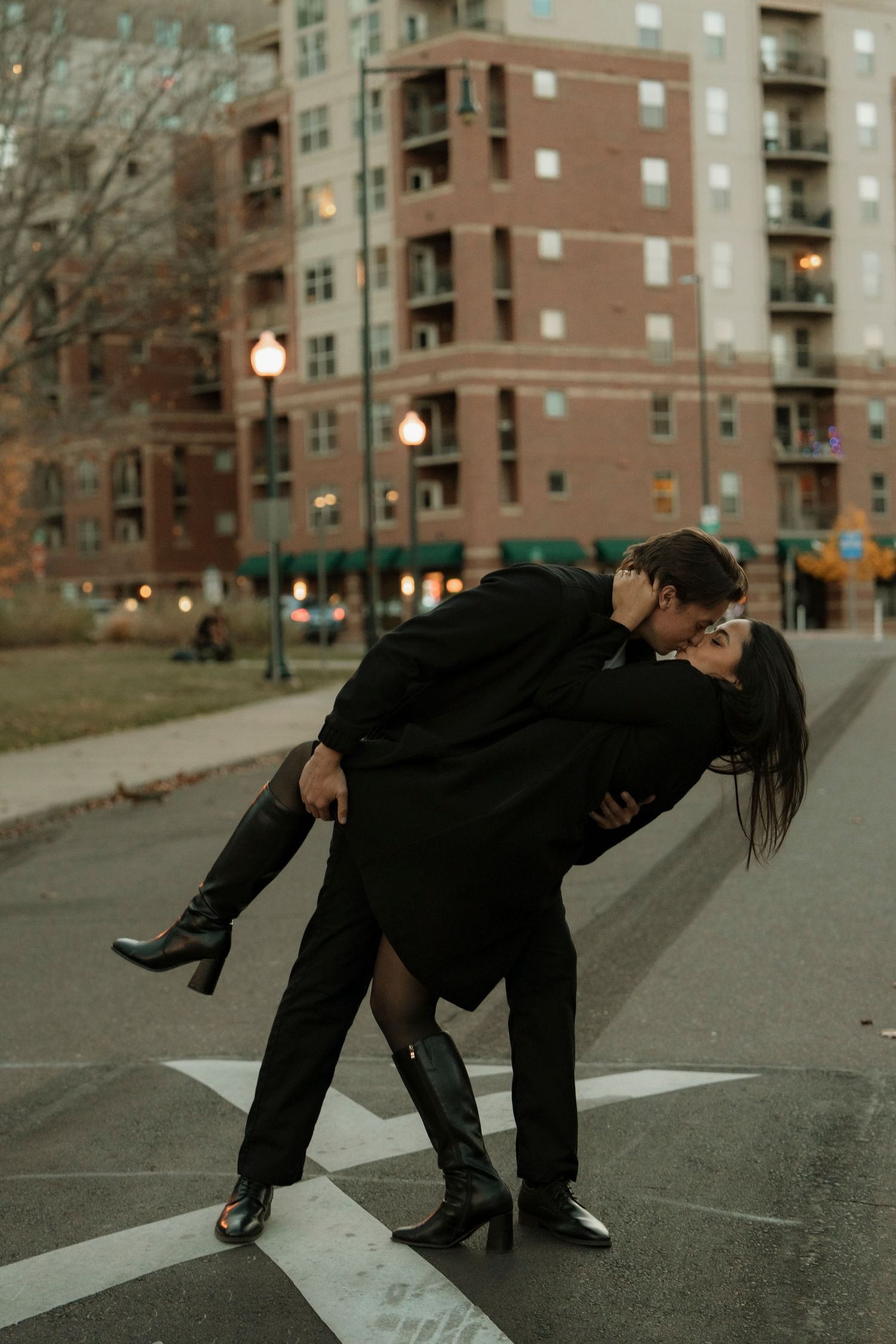 Close-up of hands reaching towards each other in a dreamy outdoor setting.
