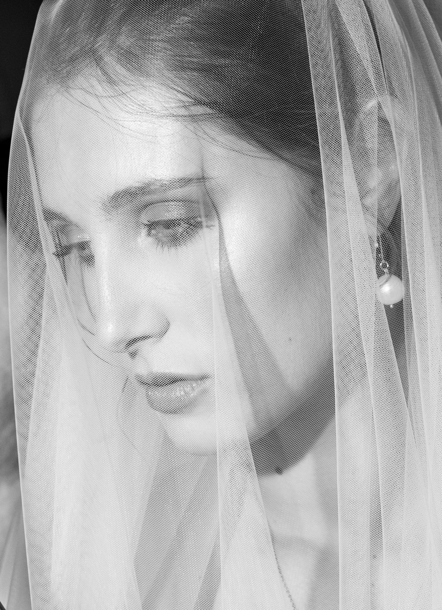 Ethereal black and white portraits with delicate veil details.