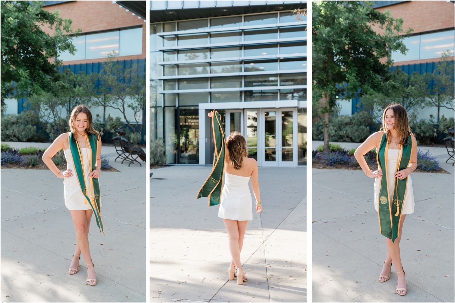 cal poly graduation session on campus with graduate in white dress and green cal poly stole