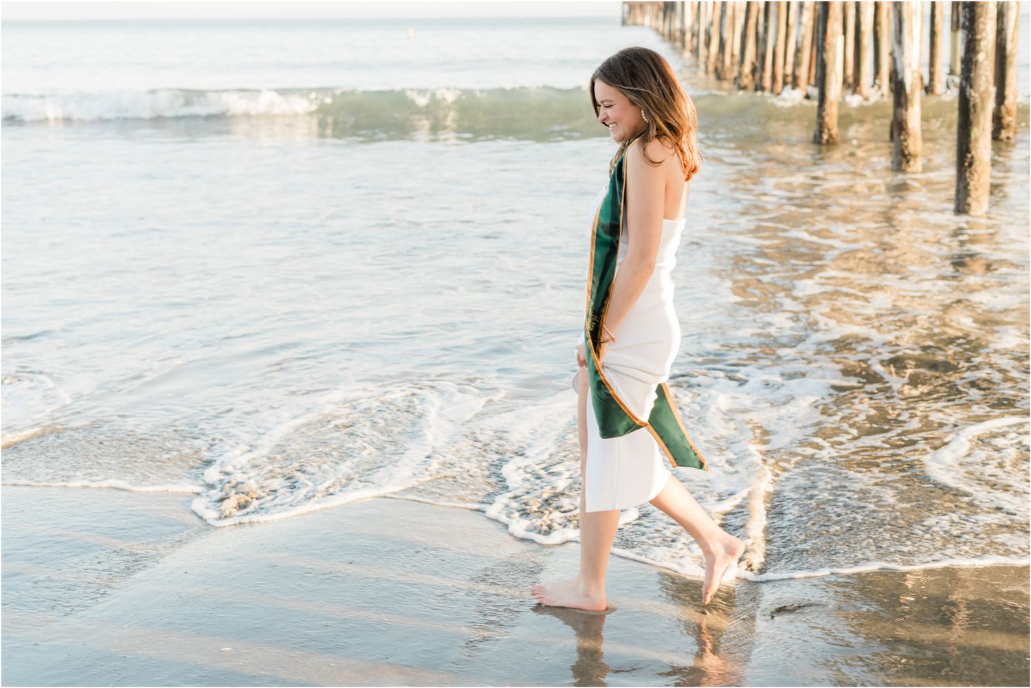 cal poly grad walking on beach for senior photos | Avila beach senior photos | slo senior photos | Felisha connolly senior photographer